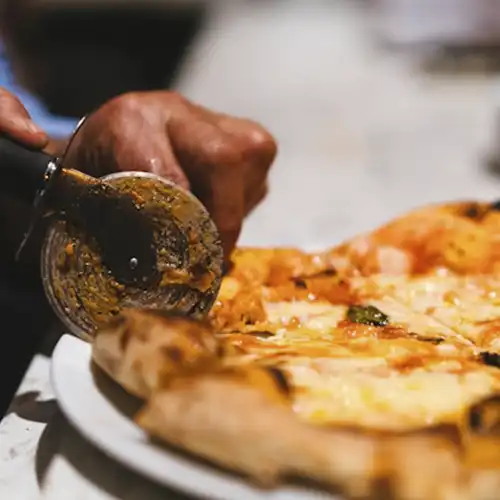 Two cheese and mushroom pizza on box